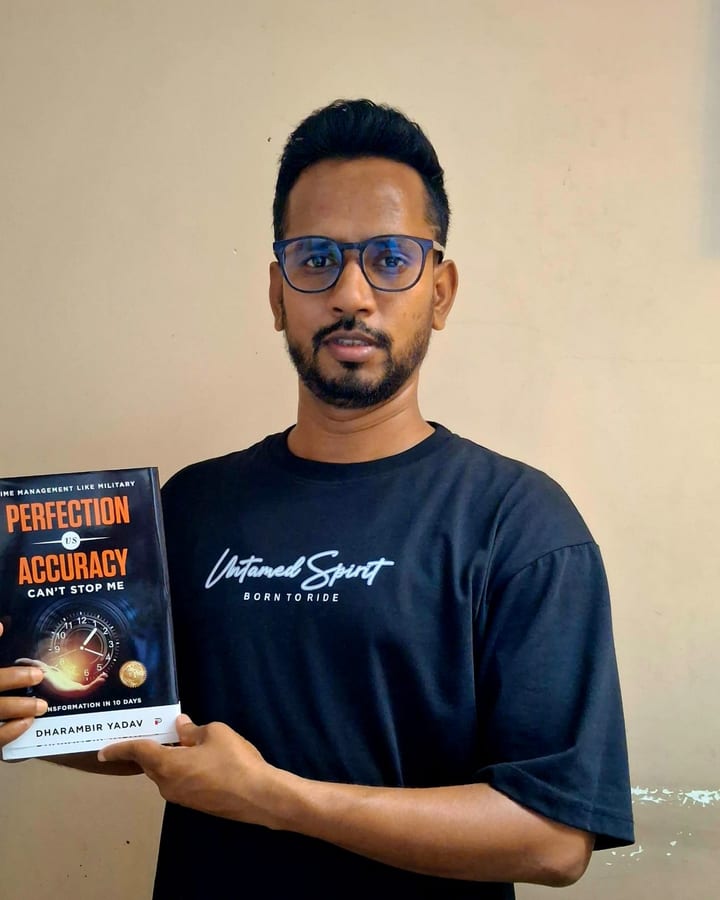 Dharambir Yadav, published author of Perfection vs Accuracy, holding his paperback