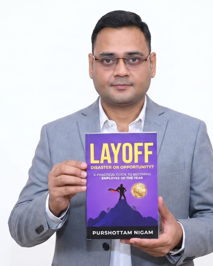 Purshottam Nigam, published author of Layoff — Disaster or Opportunity, holding his Amazon #1 bestseller