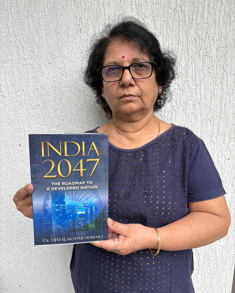 Dr Vijayalakshmi Hebbare, published author of India 2047, holding her paperback